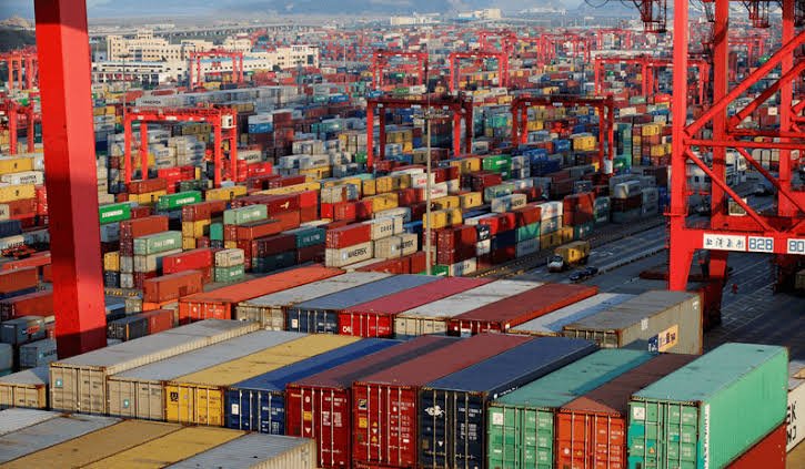 Containers stacked under the gantry cranes at the port
